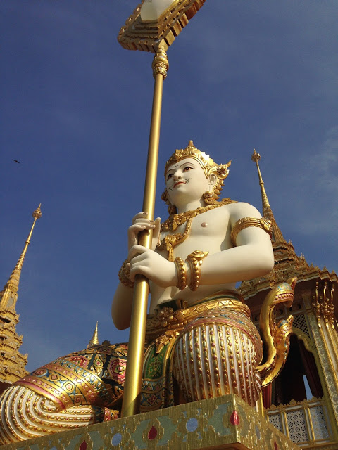 golden statues from Thai cosmology at royal crematorium